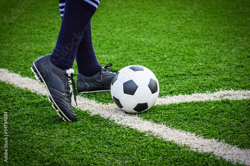 foot kicking soccer ball on corner © tungphoto