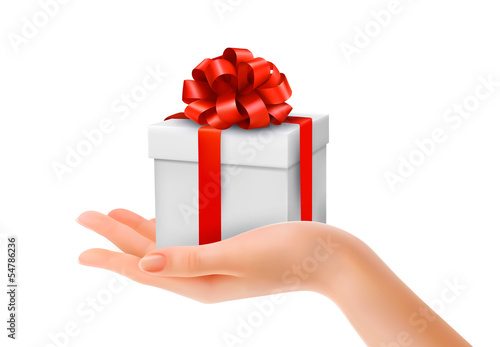 Gift box in hand with red bow and ribbons. Vector.
