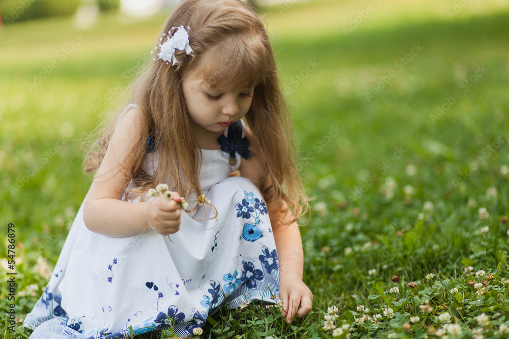 Girl with sunflower in summer field Girl with sunflower in summer field