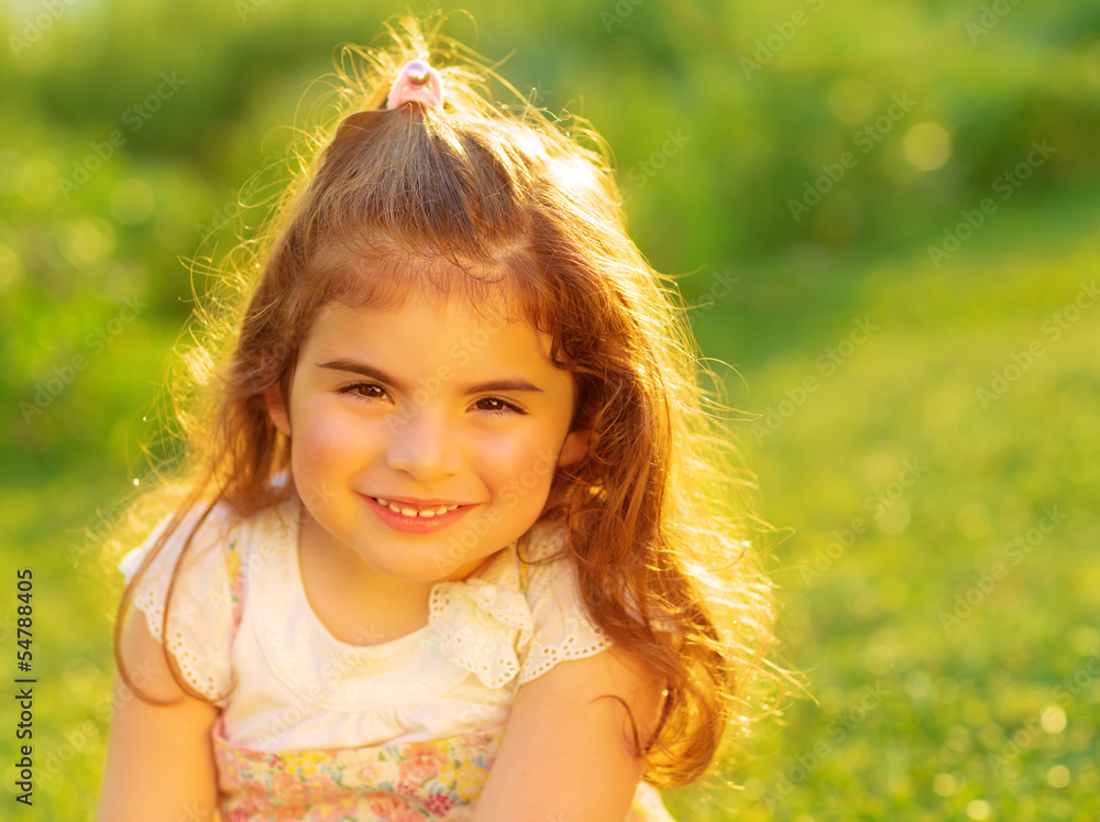 Cute little girl on green field Cute little girl on green field
