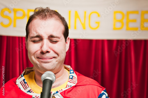 A spelling bee contestant.