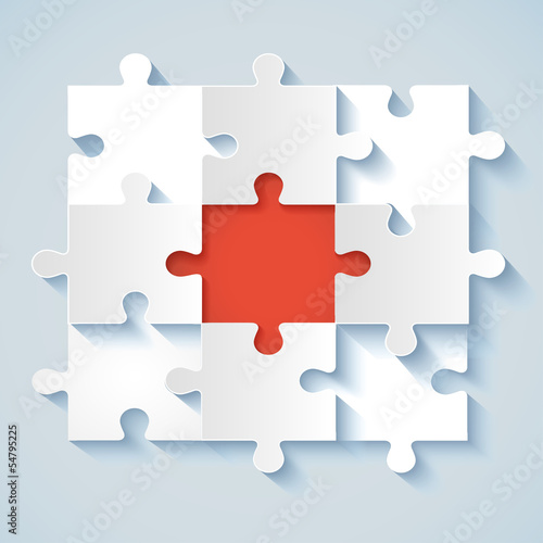 Paper puzzle with red the middle for business concepts