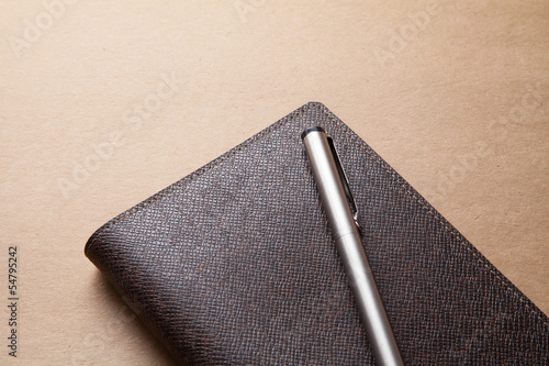 notebook with pen.