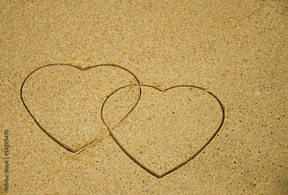 Two hearts on sand