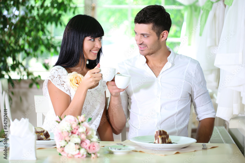 Beautiful young romantic couple at cafe Beautiful young romantic couple at cafe