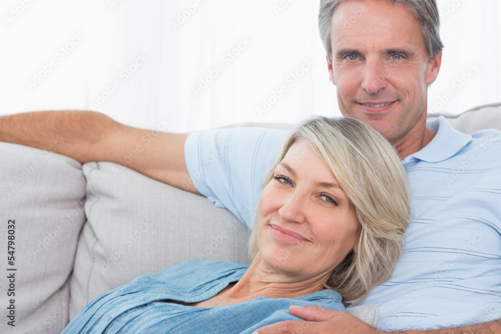 Cheerful couple relaxing at home Cheerful couple relaxing at home