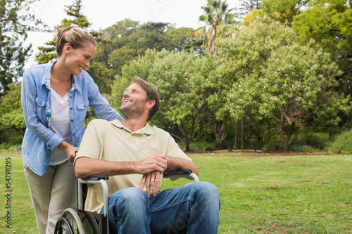 Smiling man in wheelchair talking with partner © WavebreakmediaMicro