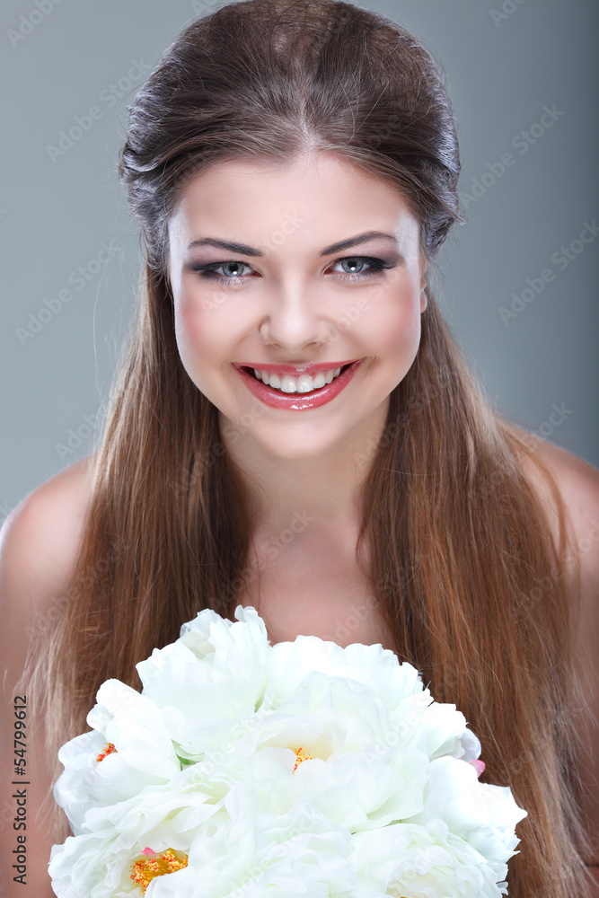 beautiful young girl with the bouquet of white colors in a hand beautiful young girl with the bouquet of white colors in a hand