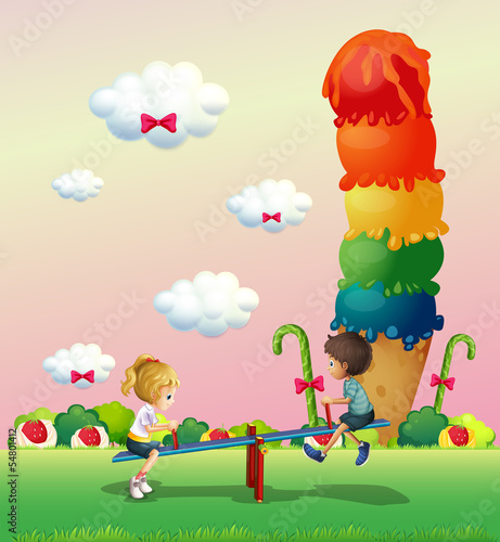 A boy and a girl playing at the park with sweets