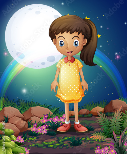 A little girl in the rocky garden