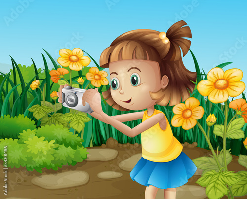 A girl taking photos at the garden