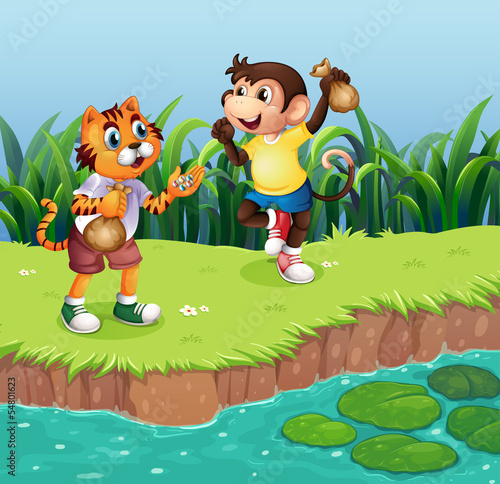 Fototapeta Naklejka Na Ścianę i Meble -  A monkey and a tiger playing