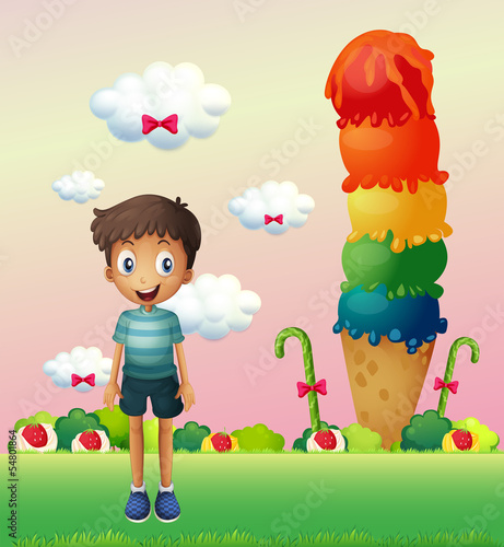A boy standing near the big ice cream