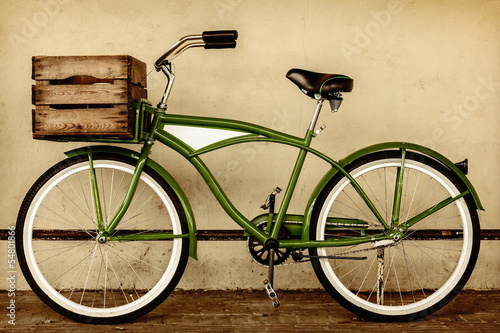 Retro styled sepia image of a vintage bicycle with wooden crate #54801866