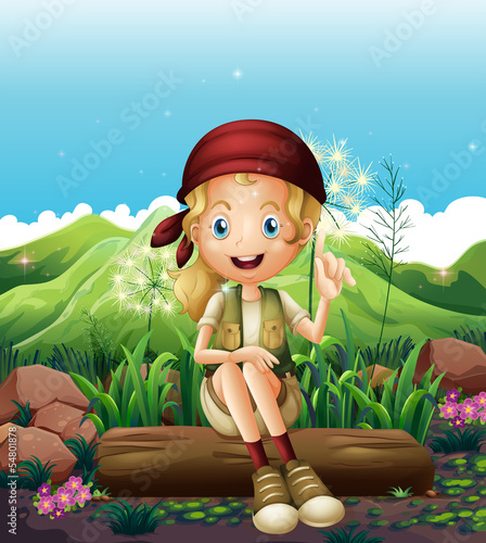 A smiling girl resting near the rocks