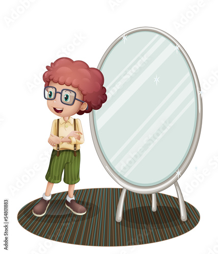 A young boy near the mirror