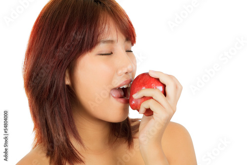 Isolated young asian woman with an apple.