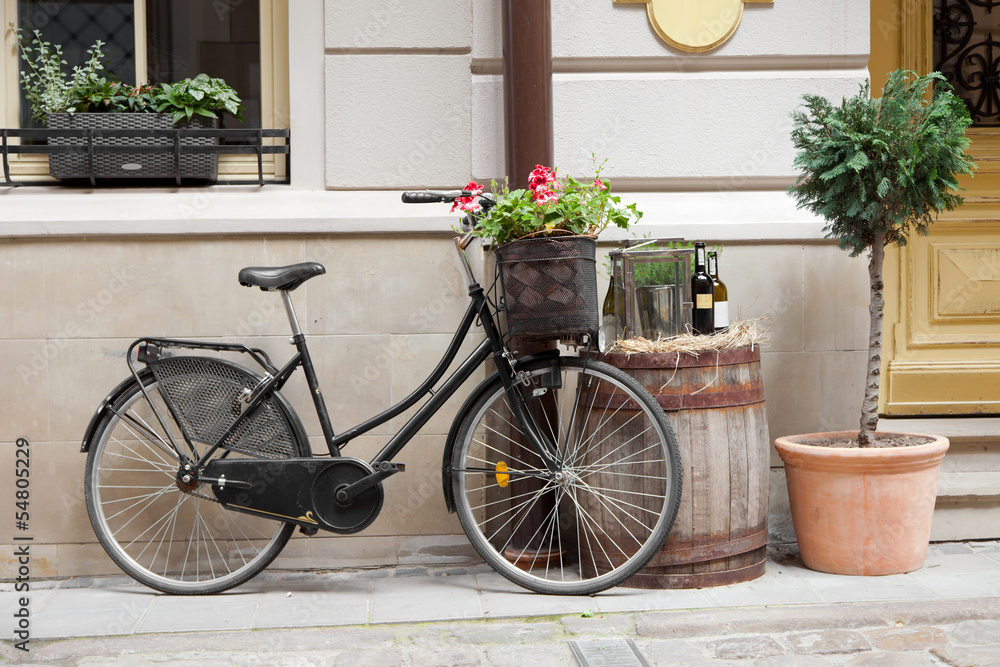 Old bicycle carrying flowers
