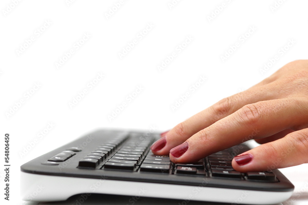 female hands typing on keyboard female hands typing on keyboard