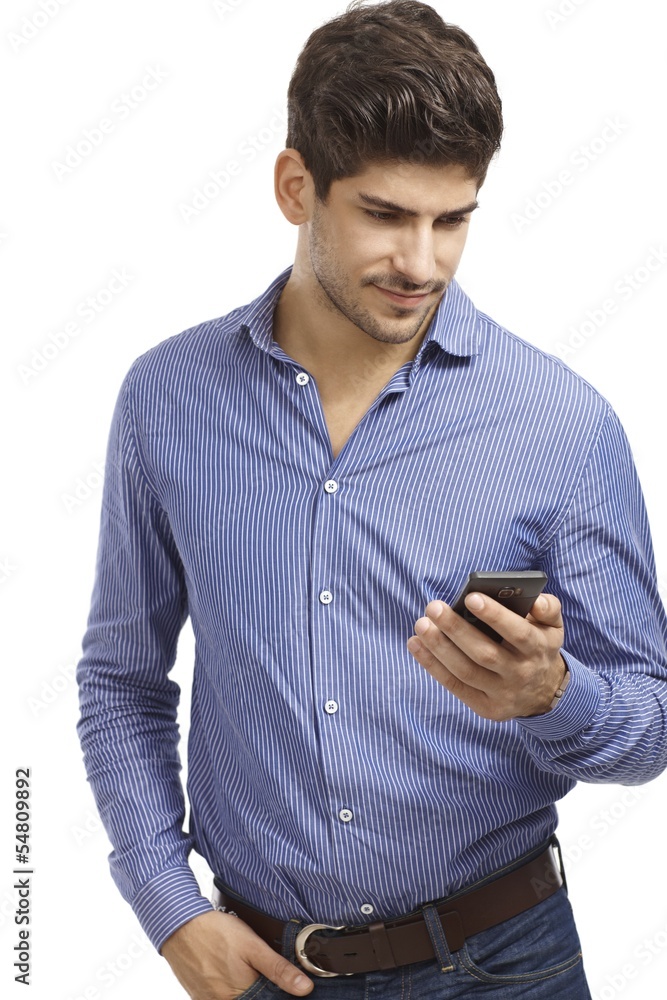 Young man using mobilephone Young man using mobilephone