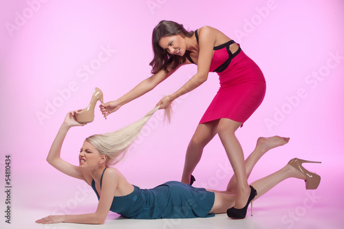 These shoes are mine! It's mine! Two angry young women fighting