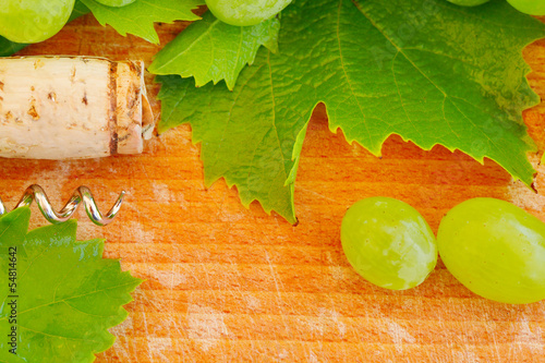 Wine background with cork, grape and leaf