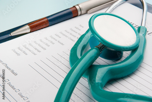 Medical Questionnaire with stethoscope on blue background