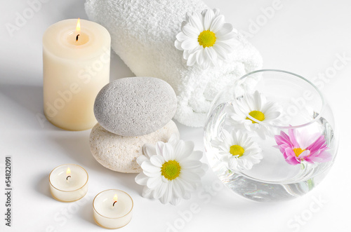 spa decoration with stones and daisies