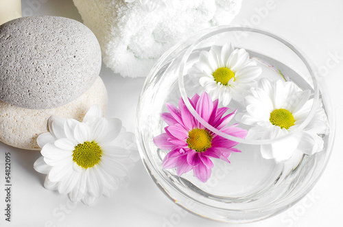 spa decoration with stones and daisies