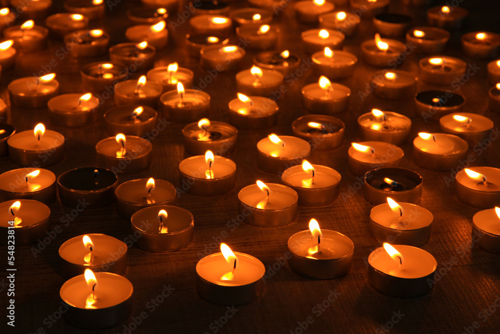 Burning candles on dark background