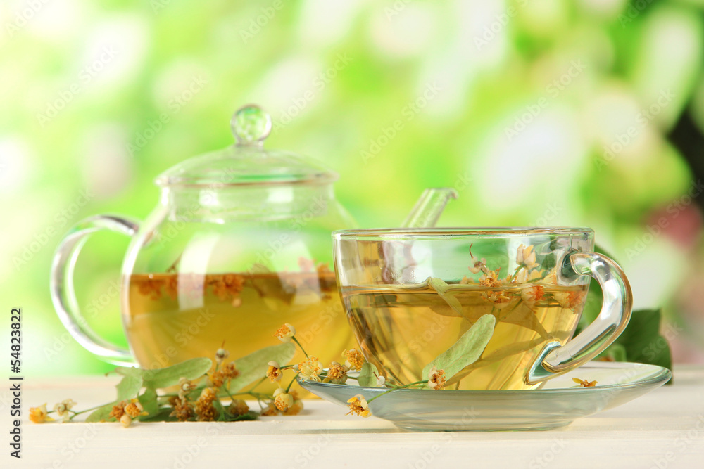 Kettle and cup of tea with linden Kettle and cup of tea with linden