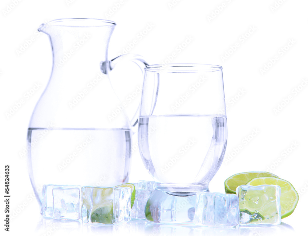 Glass pitcher of water and glass isolated on white Glass pitcher of water and glass isolated on white