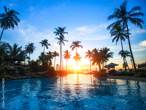 Fotografie Beautiful sunset at a beach resort in tropics