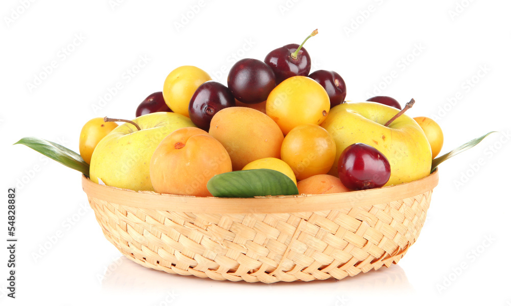 Bright summer fruits in basket isolated on white Bright summer fruits in basket isolated on white