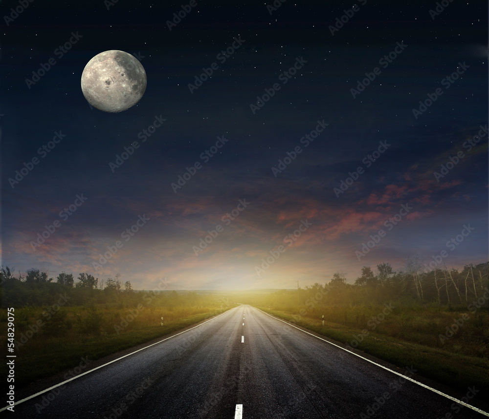 Fototapeta premium Country road with a dark sky