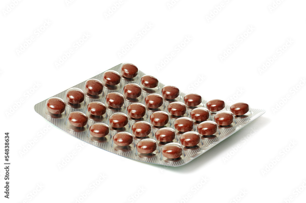 Package with brown tablets Package with brown tablets