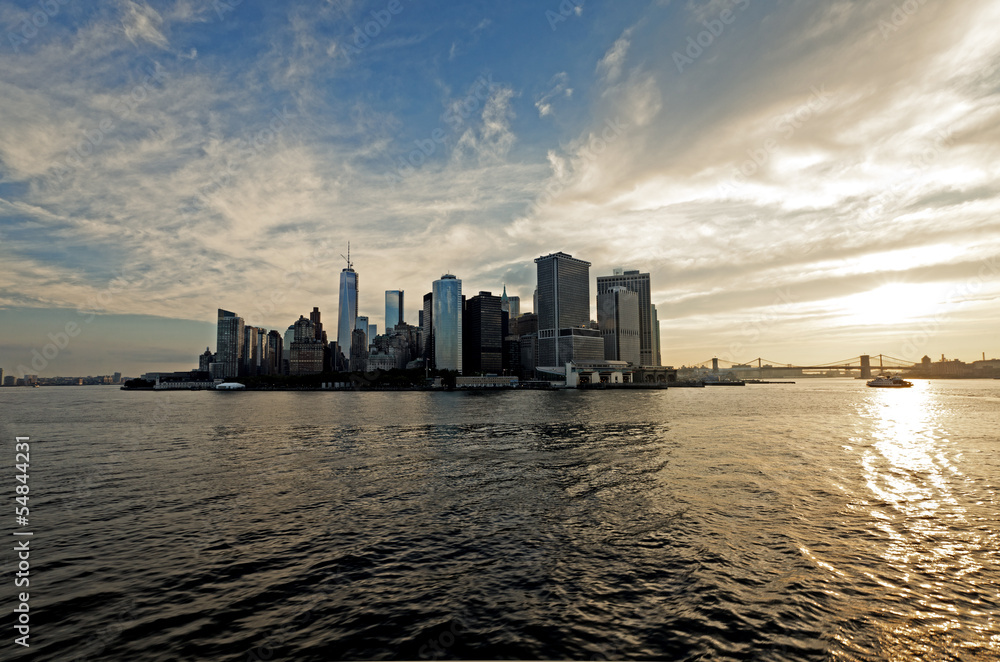 Lower Manhattan panorama of the East River in the rays of the ri