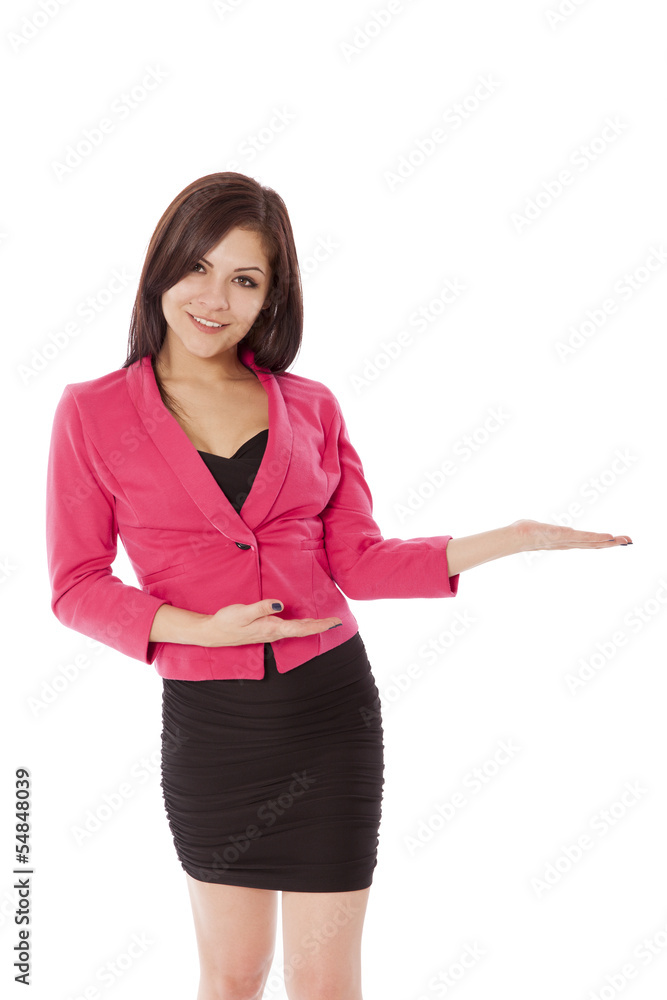Young woman in business outfit gestures towards a product. Young woman in business outfit gestures towards a product.