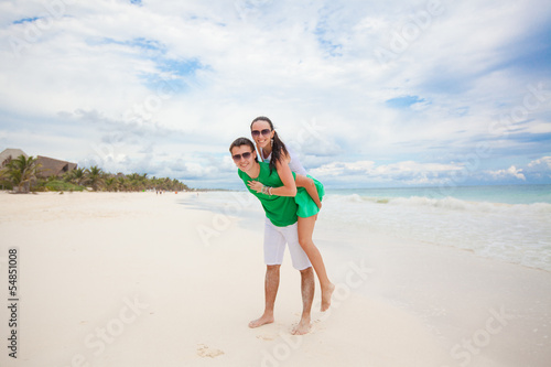 Young couple enjoying each other on a tropical beach