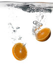 Healthy Orange slices with water splashes isolated on white