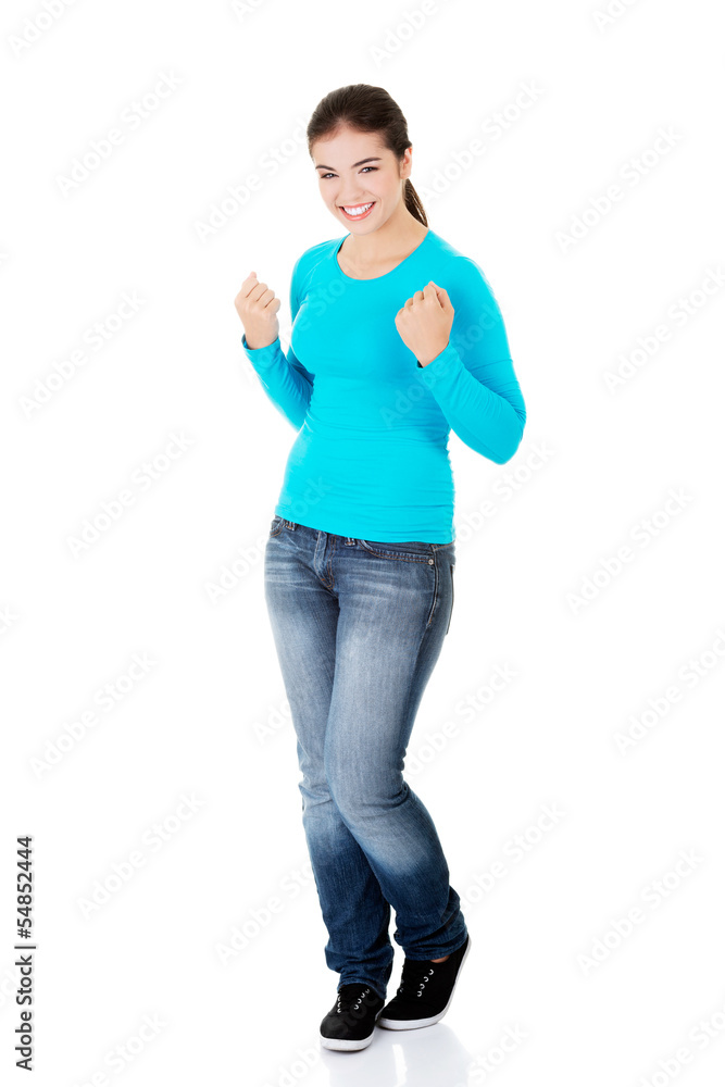 Excited happy success young woman with fists up Excited happy success young woman with fists up