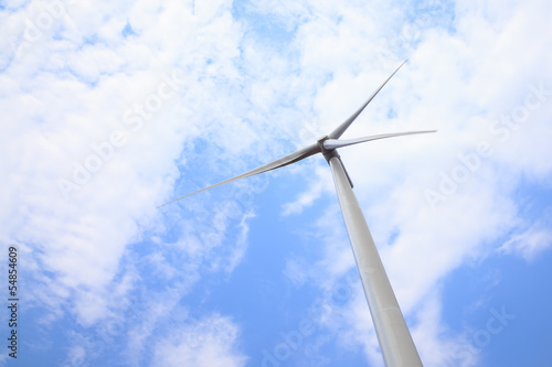 Wind turbine power generator under blue sky