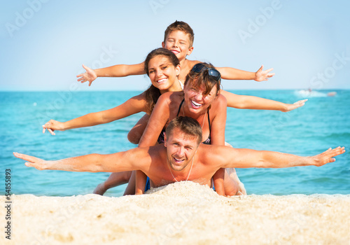 Happy Family Having Fun at the Beach. Summer Holidays