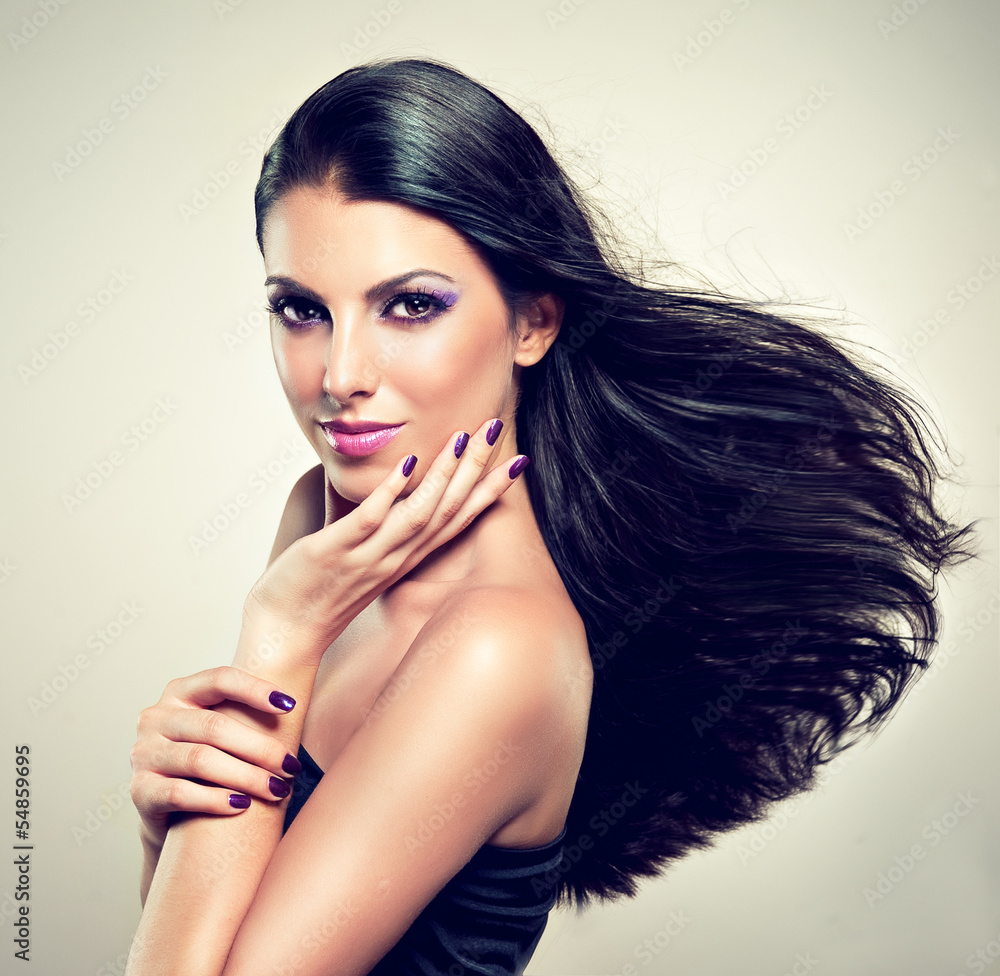 Naklejka premium Beautiful brunette with long hair flying