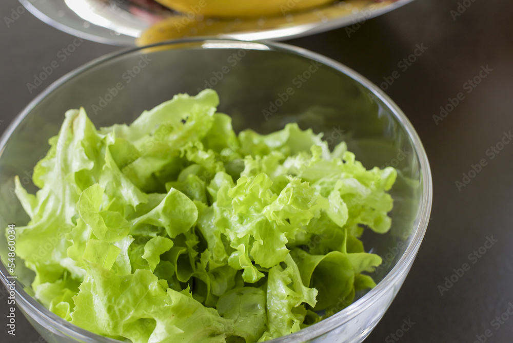 glass bowl of green salad leafs glass bowl of green salad leafs