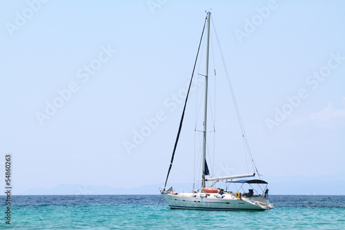 sailing boat anchored in a bay