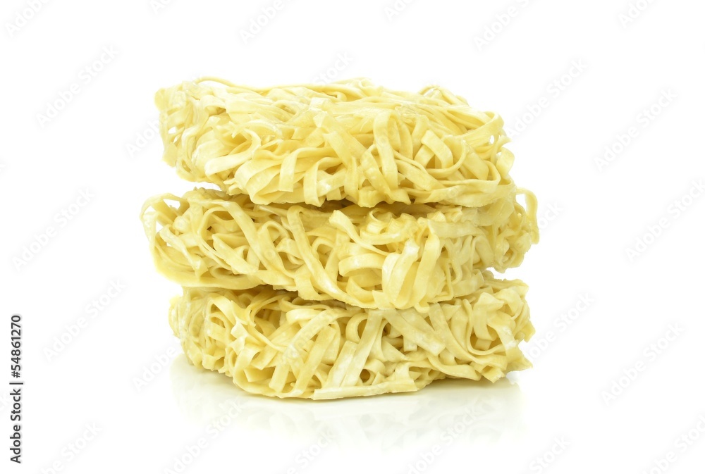 A stack of instant noodles on a white background A stack of instant noodles on a white background