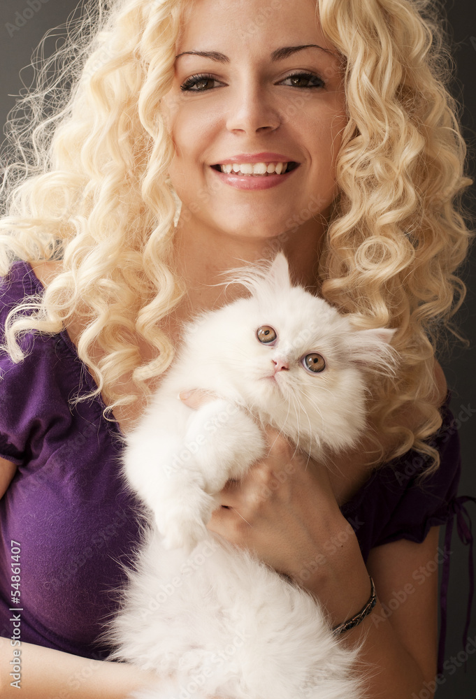 Beautiful young woman holding white Persian kitten Beautiful young woman holding white Persian kitten