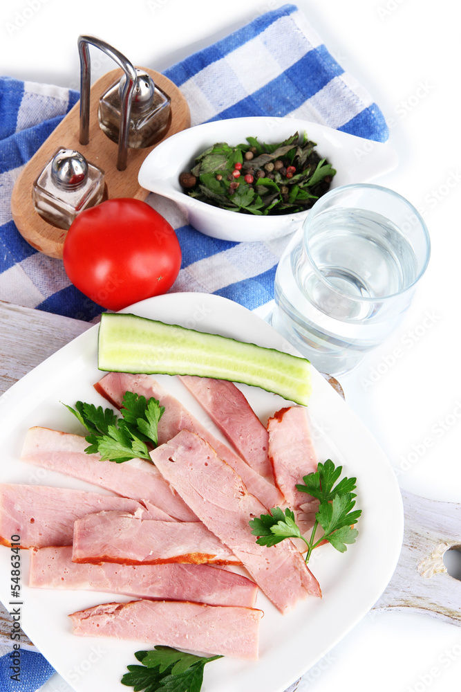 Bacon on plates on napkin on board isolated on white Bacon on plates on napkin on board isolated on white