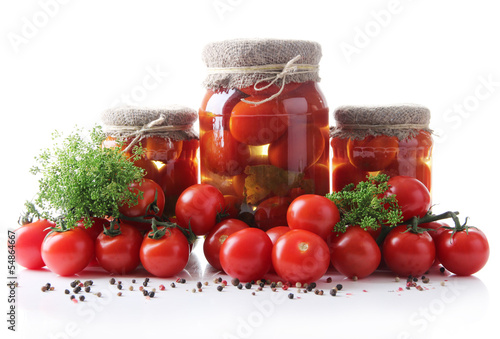 Tasty canned and fresh tomatoes, isolated on white